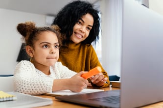 little-girl-home-online-school-with-big-sister